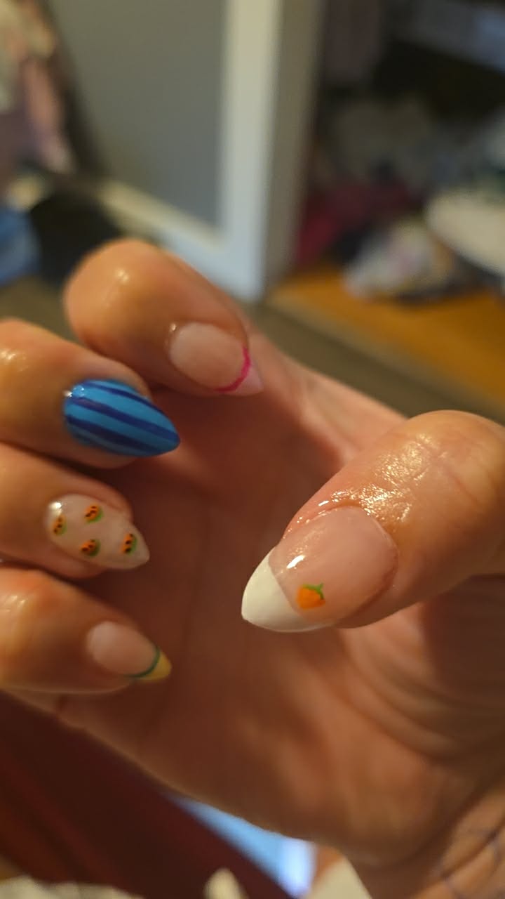 Blue striped gel manicure with fruit accents